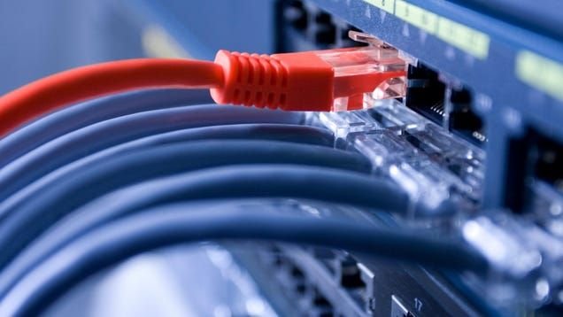 DC Metro technician installing Ethernet cables in a commercial setting, ensuring high-speed and secure connectivity.